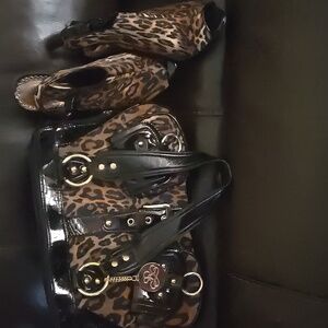 Stylish Black Shoulder Bag with Exotic Print and Glossy Accents. Shoes to match.